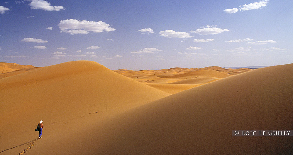 man walking in desert